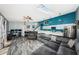 Open concept living area with modern finishes, including wood-look floors, and a skylight for natural light at 6238 92Nd N Pl # 3201, Pinellas Park, FL 33782