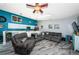 Open concept living area with modern finishes, including wood-look floors, and a skylight for natural light at 6238 92Nd N Pl # 3201, Pinellas Park, FL 33782