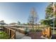 Pond with wooden pier and seating area, and US flag at 6238 92Nd N Pl # 3201, Pinellas Park, FL 33782