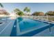 Community pool and sun deck with lounge chairs at 6238 92Nd N Pl # 3201, Pinellas Park, FL 33782