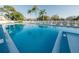 Large community swimming pool with several lounge chairs at 6238 92Nd N Pl # 3201, Pinellas Park, FL 33782