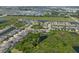 Expansive aerial view of a Primary-planned community with serene ponds and lush green spaces surrounding the neighborhood at 6307 Salt Creek Ave, Apollo Beach, FL 33572
