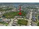 A detailed aerial view points with a red arrow to houses in a neighborhood with greenery and attractive street layout at 6307 Salt Creek Ave, Apollo Beach, FL 33572