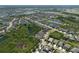 This is an aerial view of a neighborhood with ponds, trees, and attractive street layout at 6307 Salt Creek Ave, Apollo Beach, FL 33572
