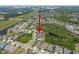 Aerial view showing the location of the home in a community featuring ponds, lush landscaping, and nearby amenities at 6307 Salt Creek Ave, Apollo Beach, FL 33572