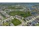 Overhead image of a neighborhood featuring well-maintained homes surrounded by ponds and natural preserves at 6307 Salt Creek Ave, Apollo Beach, FL 33572