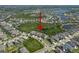 Aerial shot of a home nestled in a lush community, highlighted by a red arrow for emphasis and easy location at 6307 Salt Creek Ave, Apollo Beach, FL 33572