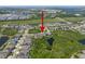 Expansive aerial view of a Primary-planned community with serene ponds and lush green spaces surrounding the neighborhood at 6307 Salt Creek Ave, Apollo Beach, FL 33572