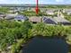 Backyard view features a pond and green area, providing a private, tranquil outdoor living space at 6307 Salt Creek Ave, Apollo Beach, FL 33572