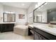 This bathroom features dual sinks, granite countertops, and a soaking tub at 6307 Salt Creek Ave, Apollo Beach, FL 33572