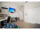 Well-lit bedroom featuring a large closet, desk, and a mounted television at 6307 Salt Creek Ave, Apollo Beach, FL 33572