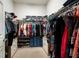 A large closet with shelving for shoes, drawers, and hanging racks at 6307 Salt Creek Ave, Apollo Beach, FL 33572