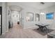 Spacious hallway with tile floors leading to an open-concept dining and living area at 6307 Salt Creek Ave, Apollo Beach, FL 33572