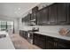 Modern kitchen features stainless steel appliances, dark cabinets, and beautiful countertops at 6307 Salt Creek Ave, Apollo Beach, FL 33572
