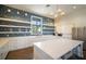 Modern clubhouse kitchen featuring stylish backsplash, stainless steel appliances, and a spacious island at 6307 Salt Creek Ave, Apollo Beach, FL 33572