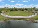 Expansive community park featuring a stage, seating, landscaping and a tranquil lake backdrop at 6307 Salt Creek Ave, Apollo Beach, FL 33572