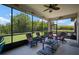 Relaxing screened patio with lush greenery and comfortable seating for enjoying the outdoors at 6307 Salt Creek Ave, Apollo Beach, FL 33572
