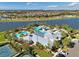 Aerial view of tennis courts and other community amenities including a pool and clubhouse at 6307 Salt Creek Ave, Apollo Beach, FL 33572