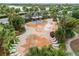 A vibrant splash pad with benches, lounge chairs and playful water features surrounded by landscaping at 6307 Salt Creek Ave, Apollo Beach, FL 33572