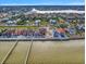 Aerial view of waterfront homes, seawalls, and docks on Tampa Bay at 6408 Bright Bay Ct, Apollo Beach, FL 33572