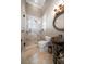 Modern bathroom with glass shower, travertine tile, and unique vessel sink at 6408 Bright Bay Ct, Apollo Beach, FL 33572