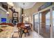 Dining area flows from kitchen, featuring water views, fireplace and comfortable seating at 6408 Bright Bay Ct, Apollo Beach, FL 33572