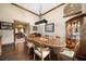 Formal dining room features a wood table, hardwood floors, and wood trim at 6408 Bright Bay Ct, Apollo Beach, FL 33572