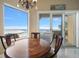 Dining room features beautiful water view, elegant chandelier, and an ornate wood table at 6408 Bright Bay Ct, Apollo Beach, FL 33572