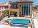 Backyard featuring a sparkling pool and waterfront views, creating a perfect outdoor retreat for relaxation and enjoyment at 6408 Bright Bay Ct, Apollo Beach, FL 33572