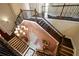 An elegant foyer with hardwood stairs, wrought iron railings and a decorative chandelier at 6408 Bright Bay Ct, Apollo Beach, FL 33572