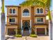Beautiful mediterranean home with a well-manicured yard, two car garage, and ocean view at 6408 Bright Bay Ct, Apollo Beach, FL 33572
