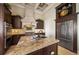 Gourmet kitchen features custom cabinetry, stone countertops and stainless steel appliances at 6408 Bright Bay Ct, Apollo Beach, FL 33572