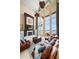 Spacious living room boasts a fireplace, large windows overlooking ocean and comfortable seating at 6408 Bright Bay Ct, Apollo Beach, FL 33572
