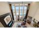 Open living room with soaring windows offers ocean views, fireplace, and inviting seating area at 6408 Bright Bay Ct, Apollo Beach, FL 33572