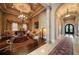 Elegant living room with decorative ceiling, arched doorway and hardwood floors at 6408 Bright Bay Ct, Apollo Beach, FL 33572