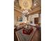 Elegant living room with hardwood floors, decorative ceiling, and columns at 6408 Bright Bay Ct, Apollo Beach, FL 33572