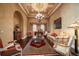 Elegant living room boasts hardwood floors and decorative ceiling at 6408 Bright Bay Ct, Apollo Beach, FL 33572