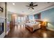 Spacious main bedroom with hardwood floors, fireplace, and balcony access at 6408 Bright Bay Ct, Apollo Beach, FL 33572