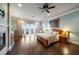 Spacious main bedroom with hardwood floors, fireplace, and balcony access at 6408 Bright Bay Ct, Apollo Beach, FL 33572