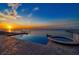 Enjoy scenic water views from this beautiful infinity pool with a built-in spa overlooking the ocean at 6408 Bright Bay Ct, Apollo Beach, FL 33572