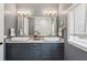 Beautiful bathroom with dual sinks, vanity with great storage, and decorative lighting at 6461 Rubia Cir, Apollo Beach, FL 33572