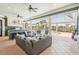 Expansive outdoor living area featuring a kitchen, lounge seating, and a pool, perfect for relaxation and gatherings at 6461 Rubia Cir, Apollo Beach, FL 33572