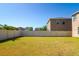 Well-maintained backyard with a large grassy area, perfect for recreation and relaxation in a private setting at 6534 Trent Creek Dr, Ruskin, FL 33573
