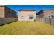 Large backyard with lush green grass, offering a secure and spacious area for outdoor enjoyment and activities at 6534 Trent Creek Dr, Ruskin, FL 33573