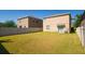 Spacious, fully fenced backyard with lush lawn and sliding glass doors, great for outdoor living at 6534 Trent Creek Dr, Ruskin, FL 33573