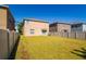 Expansive backyard featuring lush green grass and a sturdy privacy fence for secure outdoor enjoyment at 6534 Trent Creek Dr, Ruskin, FL 33573