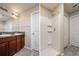 Bathroom with double sinks, granite countertops and tiled shower at 6534 Trent Creek Dr, Ruskin, FL 33573