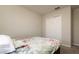 Cozy bedroom featuring a floral bedspread and a closet with white double doors at 6534 Trent Creek Dr, Ruskin, FL 33573