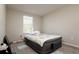Bedroom with a window, an inflatable bed, and electrical outlets at 6534 Trent Creek Dr, Ruskin, FL 33573