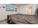 Bedroom with mounted television offers natural lighting and neutral colors at 6534 Trent Creek Dr, Ruskin, FL 33573
